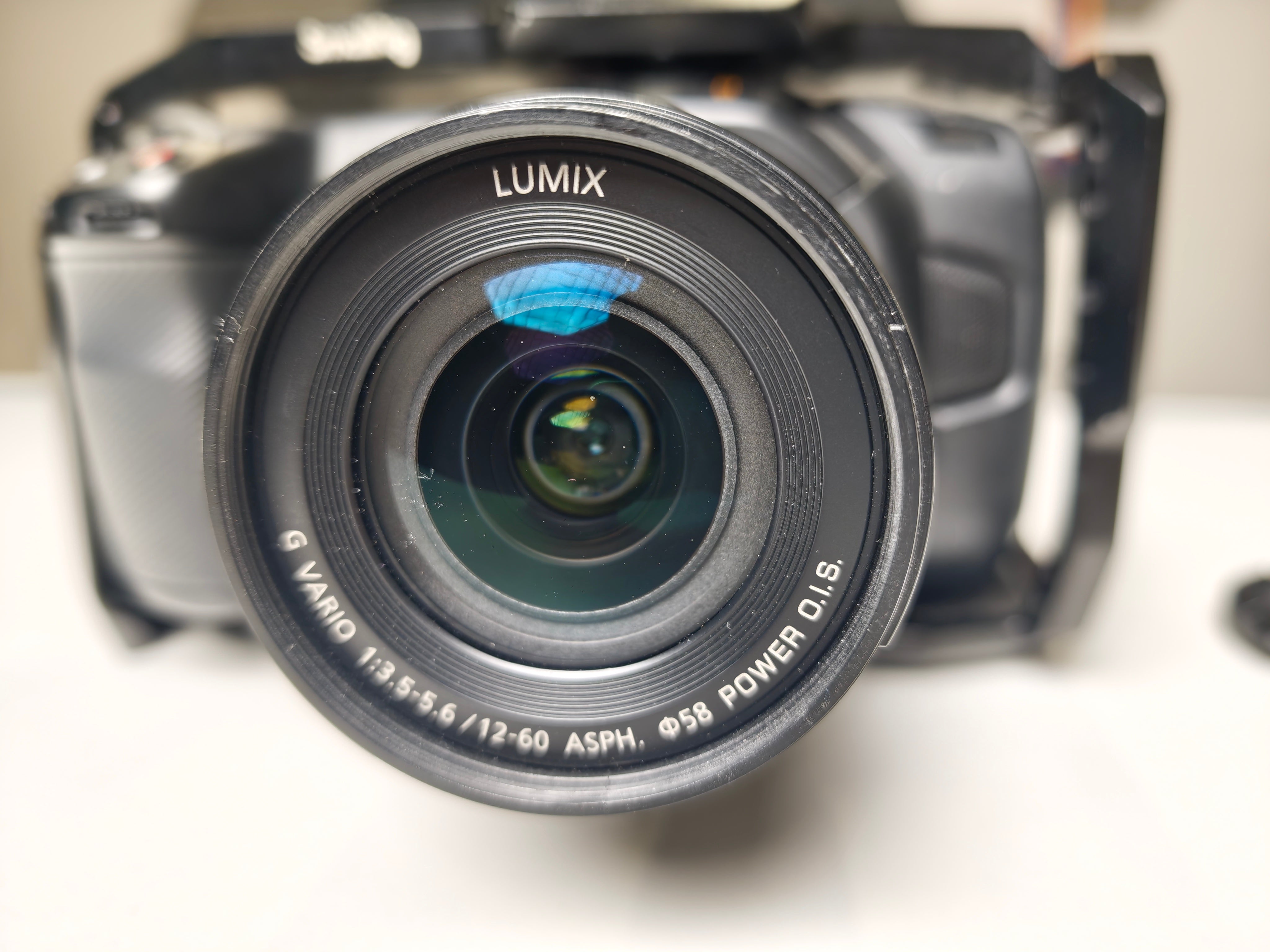 Second hand Blackmagic Pocket Cinema Camera 4K + Lumix G Vario Lens, 12-60mm f3.5-5.6 ASPH. MFT POWER O.I.S. + cage