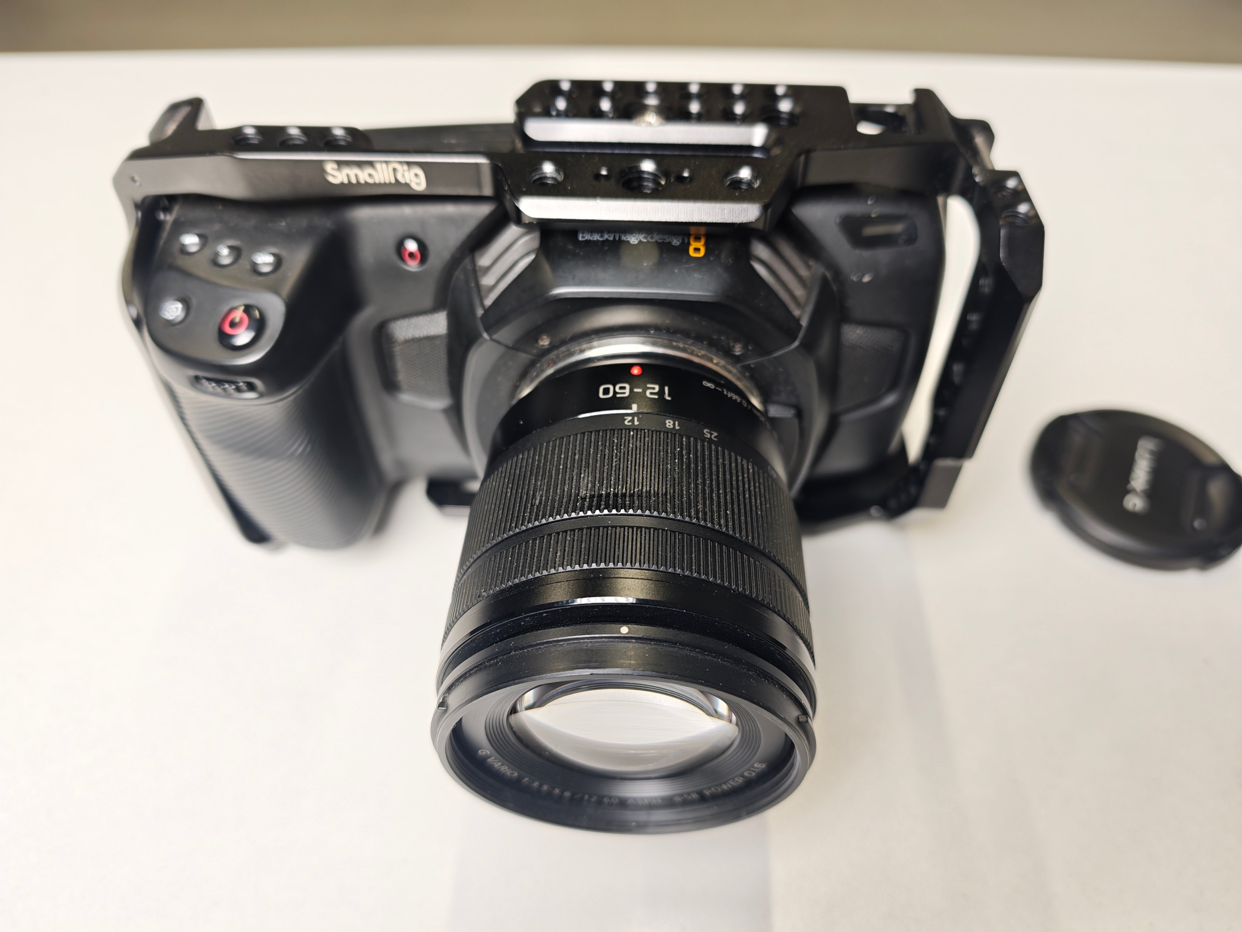 Second hand Blackmagic Pocket Cinema Camera 4K + Lumix G Vario Lens, 12-60mm f3.5-5.6 ASPH. MFT POWER O.I.S. + cage